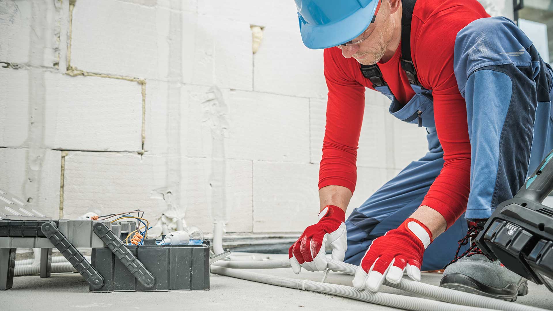 Electrician working on pipe in Yarraville